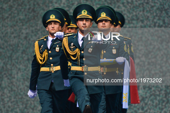 Members of the Azerbaijani Army carry flags ahead of the Women's Freestyle 69kg Wrestling medals ceremony during Baku 2017 - 4th Islamic Sol...