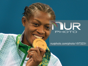 Nigeria's Odunayo Folasade Adekuoroye with her Gold medal during the Medal Ceremony of the Women's Wrestling Freestyle 55Kg event at the Bak...