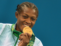 Nigeria's Odunayo Folasade Adekuoroye with her Gold medal during the Medal Ceremony of the Women's Wrestling Freestyle 55Kg event at the Bak...