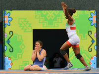 Happy Blessing Oborududu of Nigeria celebrates in front of disappointed Hafize Sahin of Turkey at the end of the Women's Freestyle 63kg Wres...