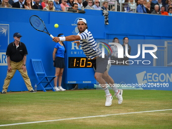 Spain's Feliciano Lopez returns against Croatia's Marin Cilic during the men's singles final tennis match at the ATP Aegon Championships ten...