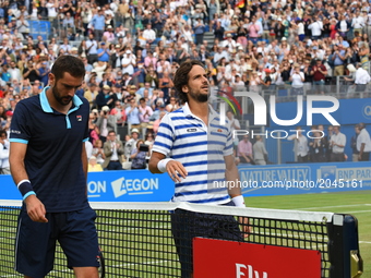 Feliciano Lopez of Spain (R) and his opponant Marin Cilic of Croatia (L) after the mens singles final on day seven of the 2017 Aegon Champio...