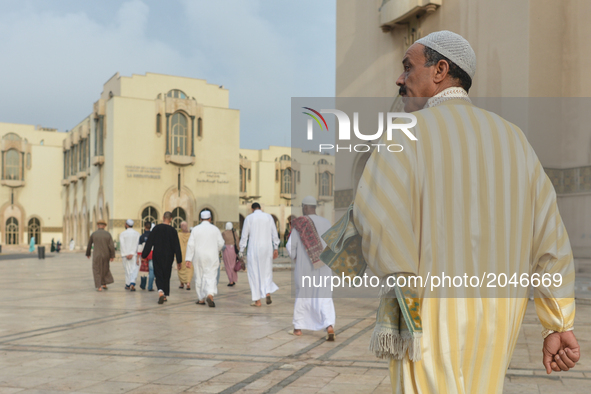 Moroccan Muslims on their way to celebrate Eid al-Fitr Prayer in Casablanca's Hassan II mosque. Muslims around the world celebrate Eid al-Fi...