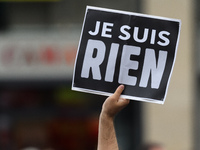 Protesters hold placards reading "I am nothing", as they attend a demonstration against the French government's planned labour law reforms o...