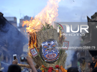 Nepalese devotees celebrate by burning effigy of demon Ghantakarna during the Ghantakarna or Gathemangal festival celebrated at Bhaktapur, N...