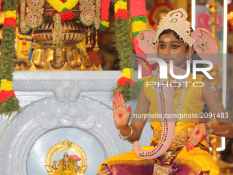 Tamil Hindu girl dressed as Lord Ganesh as children reenact one of the stories of Lord Ganesh during the Nambiyaandaar Nambi Ustavam Thiruvi...