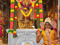 Tamil Hindu girl dressed as Lord Ganesh as children reenact one of the stories of Lord Ganesh during the Nambiyaandaar Nambi Ustavam Thiruvi...