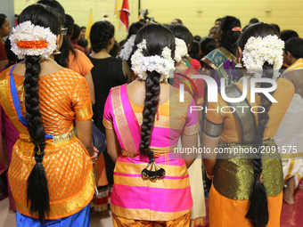 Tamil Hindu children listen to prayers after performing a Bharatnatyam dance during the Nambiyaandaar Nambi Ustavam Thiruvizha pooja at a Hi...