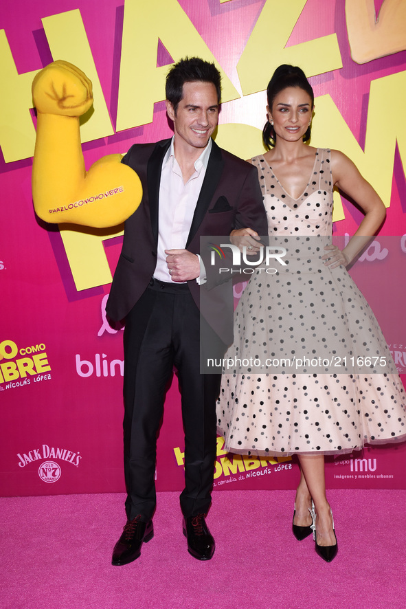 Actress Aislinn Derbez and actor Mauricio Ochmann poses during the pink carpet with a toy arm to promote the latest film 'Hazlo Como Hombre'...