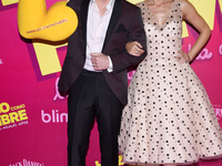 Actress Aislinn Derbez and actor Mauricio Ochmann poses during the pink carpet with a toy arm to promote the latest film 'Hazlo Como Hombre'...