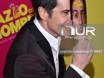 Actor Mauricio Ochmann is seen he is joking with a mask during the pink carpet  to promote the latest film 'Hazlo Como Hombre' at Cinepolis...