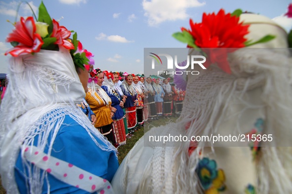 Bulgarian dancers wear Bulgarian national traditional clothes during an annual folklore festivity in the Bulgarian village of Benkovski, eas...