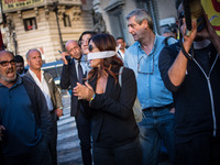 The workers of the usb union gagged against during the demonstration of the Basic Trade Union (USB) in solidarity with the workers of Corpa...