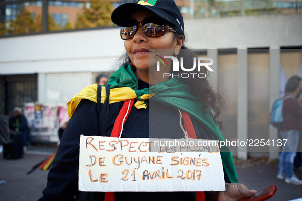 A woman wears a plaacrd asking for Macron to respect the French Guyana agreements. More than 15000 protesters took to the streets of Toulous...