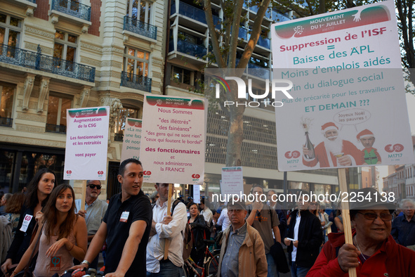 Placards against Macron's politics. More than 15000 protesters took to the streets of Toulouse against the new Macron's reforms on the Work...