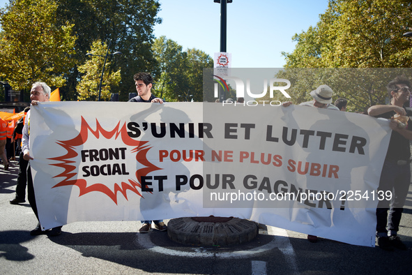 A banner reads 'Uniting and fighting for winning and no more suffer'. More than 15000 protesters took to the streets of Toulouse against the...