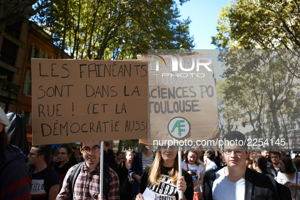 Banners read 'Lazys are in the street, also democracy'. More than 15000 protesters took to the streets of Toulouse against the new Macron's...