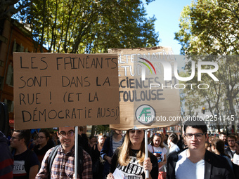 Banners read 'Lazys are in the street, also democracy'. More than 15000 protesters took to the streets of Toulouse against the new Macron's...