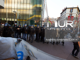 Youths confront riot police at the end of the demonstration. More than 15000 protesters took to the streets of Toulouse against the new Macr...