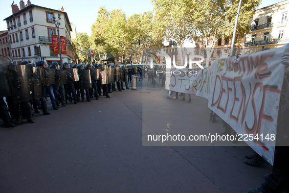 Youths confront riot police at the end of the demonstration. More than 15000 protesters took to the streets of Toulouse against the new Macr...