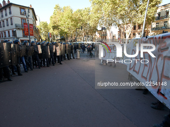 Youths confront riot police at the end of the demonstration. More than 15000 protesters took to the streets of Toulouse against the new Macr...