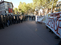 Youths confront riot police at the end of the demonstration. More than 15000 protesters took to the streets of Toulouse against the new Macr...