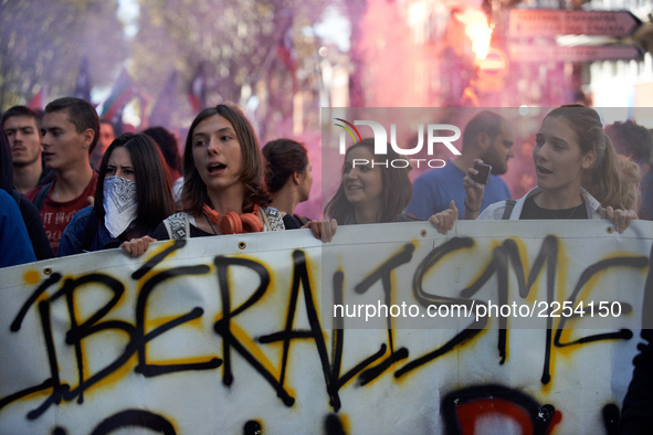 Youths shout slogans against Macron's politics. the banner reads 'liberalism'. More than 15000 protesters took to the streets of Toulouse ag...