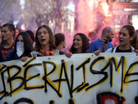 Youths shout slogans against Macron's politics. the banner reads 'liberalism'. More than 15000 protesters took to the streets of Toulouse ag...