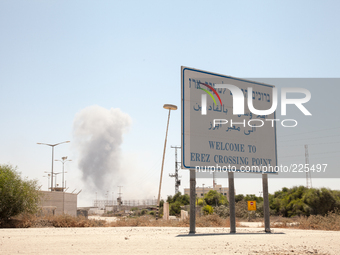 The clashes between Israeli forces and Hamas fighters were visible from the welcoming sign at the border crossing. (