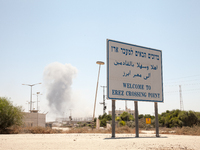 The clashes between Israeli forces and Hamas fighters were visible from the welcoming sign at the border crossing. (