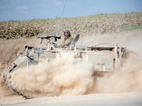 An Israeli armored troop transport vehicle on its way into the Gaza strip during Operation Margin Protector. (