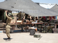 An Israeli soldier putting on the bullet proof vest at military outpost in the border crossing of Erez. (