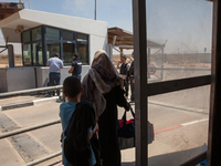 Palestinian refugees on their way back into the Gaza Strip, some of the very few that decided to come back during the still ongoing Operatio...