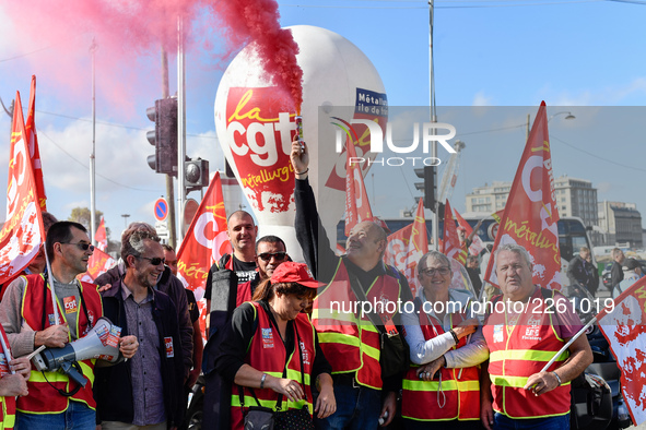 Metalworkers demonstrate as they march with banners and flags in the streets of Paris on October 13, 2017. Several thousand workers have tak...