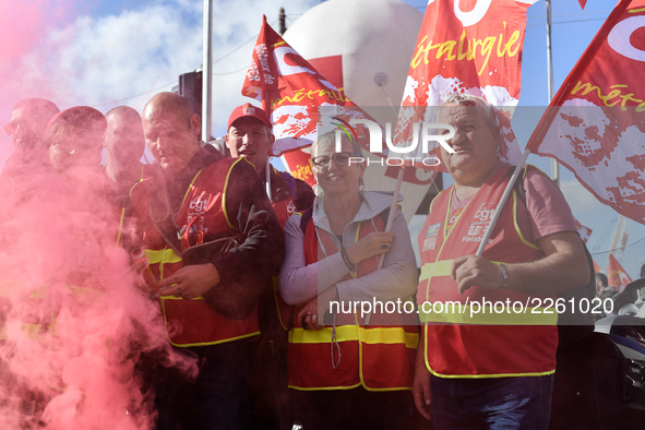 Metalworkers demonstrate as they march with banners and flags in the streets of Paris on October 13, 2017. Several thousand workers have tak...