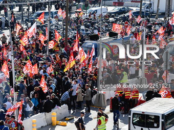 Metalworkers demonstrate as they march with banners and flags in the streets of Paris on October 13, 2017. Several thousand workers have tak...