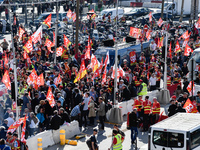 Metalworkers demonstrate as they march with banners and flags in the streets of Paris on October 13, 2017. Several thousand workers have tak...