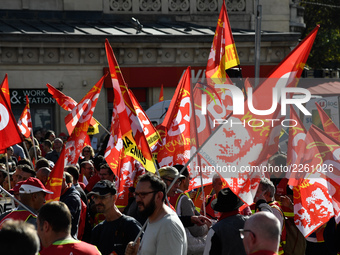 Metalworkers demonstrate as they march with banners and flags in the streets of Paris on October 13, 2017. Several thousand workers have tak...