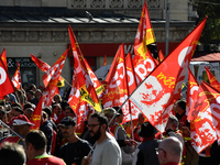 Metalworkers demonstrate as they march with banners and flags in the streets of Paris on October 13, 2017. Several thousand workers have tak...