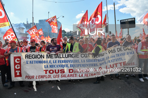 Metalworkers demonstrate as they march with banners and flags in the streets of Paris on October 13, 2017. Several thousand workers have tak...