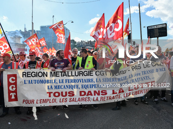 Metalworkers demonstrate as they march with banners and flags in the streets of Paris on October 13, 2017. Several thousand workers have tak...