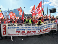 Metalworkers demonstrate as they march with banners and flags in the streets of Paris on October 13, 2017. Several thousand workers have tak...