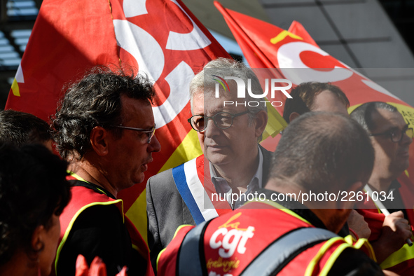 Secretary general of the French Communist Party, Pierre Laurent (C) takes part in a Metalworkers demonstration as they march with banners an...