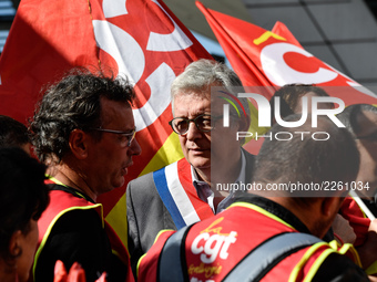 Secretary general of the French Communist Party, Pierre Laurent (C) takes part in a Metalworkers demonstration as they march with banners an...