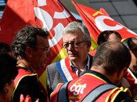 Secretary general of the French Communist Party, Pierre Laurent (C) takes part in a Metalworkers demonstration as they march with banners an...