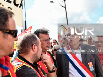 Secretary general of the French Communist Party, Pierre Laurent (C) takes part in a Metalworkers demonstration as they march with banners an...