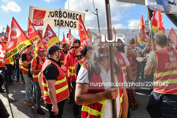 Metalworkers demonstrate as they march with banners and flags in the streets of Paris on October 13, 2017. Several thousand workers have tak...