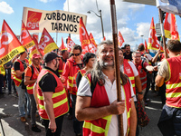 Metalworkers demonstrate as they march with banners and flags in the streets of Paris on October 13, 2017. Several thousand workers have tak...