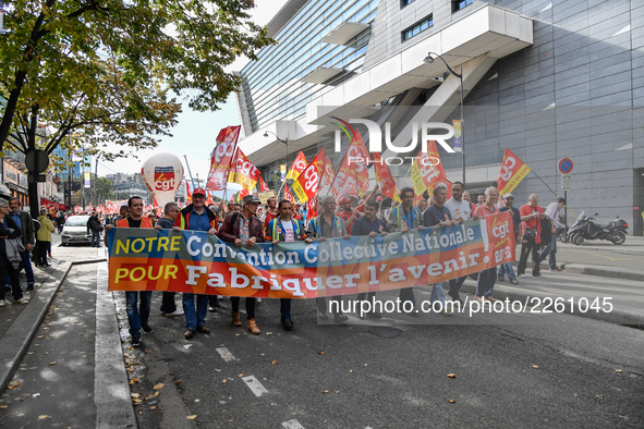 Metalworkers demonstrate as they march with banners and flags in the streets of Paris on October 13, 2017. Several thousand workers have tak...