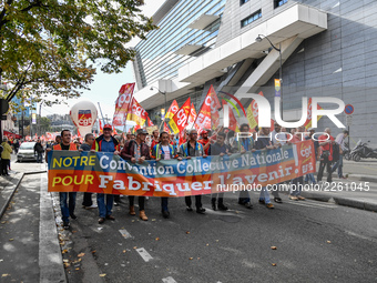 Metalworkers demonstrate as they march with banners and flags in the streets of Paris on October 13, 2017. Several thousand workers have tak...